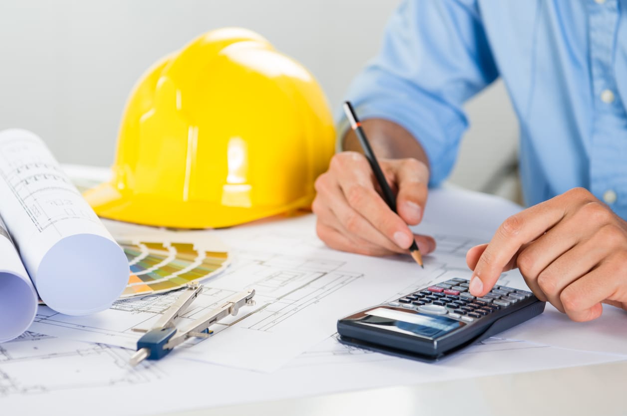 An architect using a construction calculator